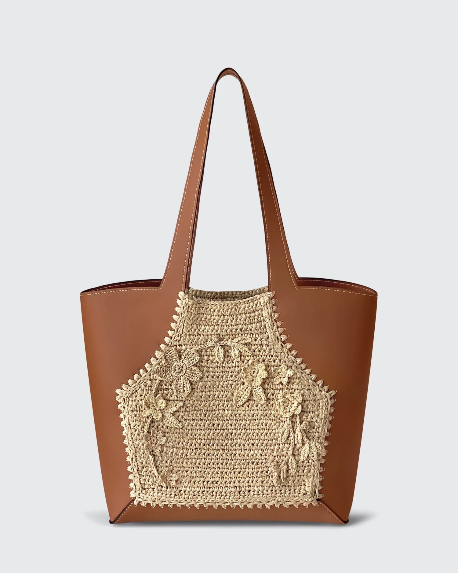 Brown vegan leather ROSIE HONG tote bag with intricate woven floral design, perfect for stylish everyday use.