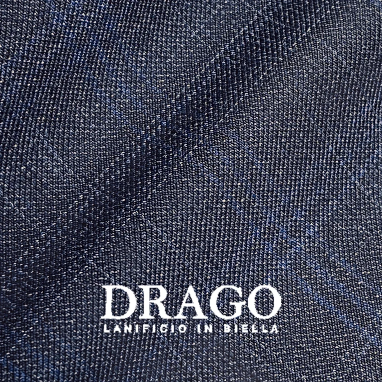 Dark navy fabric texture with diagonal pattern by Drago, Lanificio in Biella, showcasing textile detail and quality.