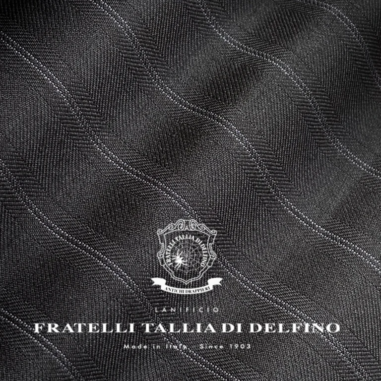 Elegant gray fabric texture from Fratelli Tallia di Delfino, showcasing fine craftsmanship. Made in Italy since 1903.
