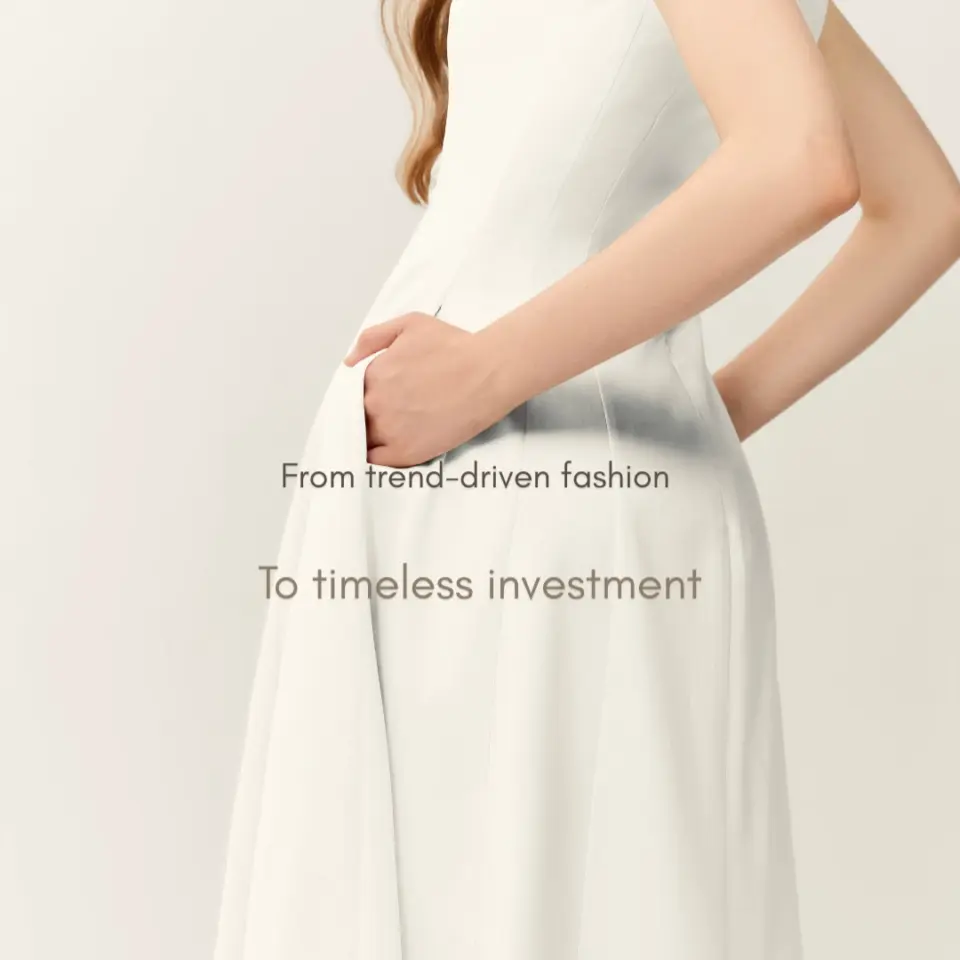 Elegant white dress with text From trend-driven fashion to timeless investment.