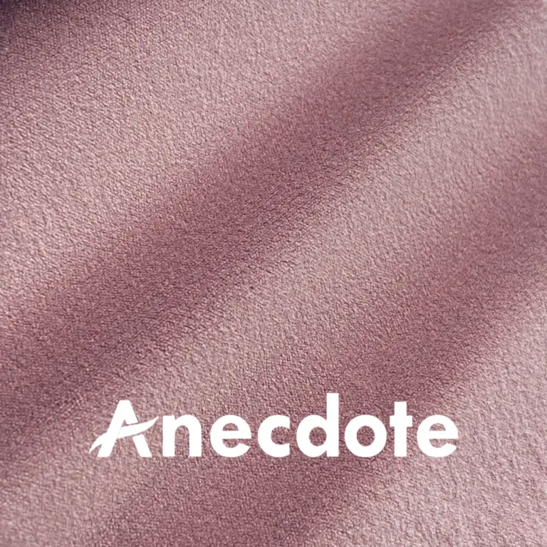 Soft pink textured fabric background with Anecdote text overlay.