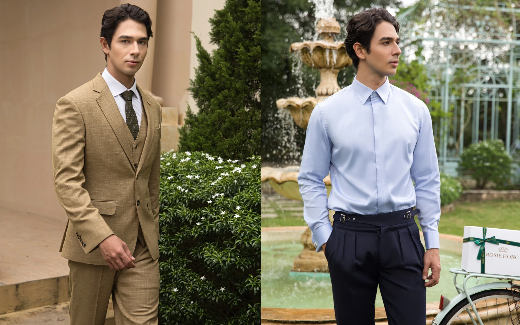Man in a tan suit and blue shirt with dark pants posing outdoors near greenery and a fountain.