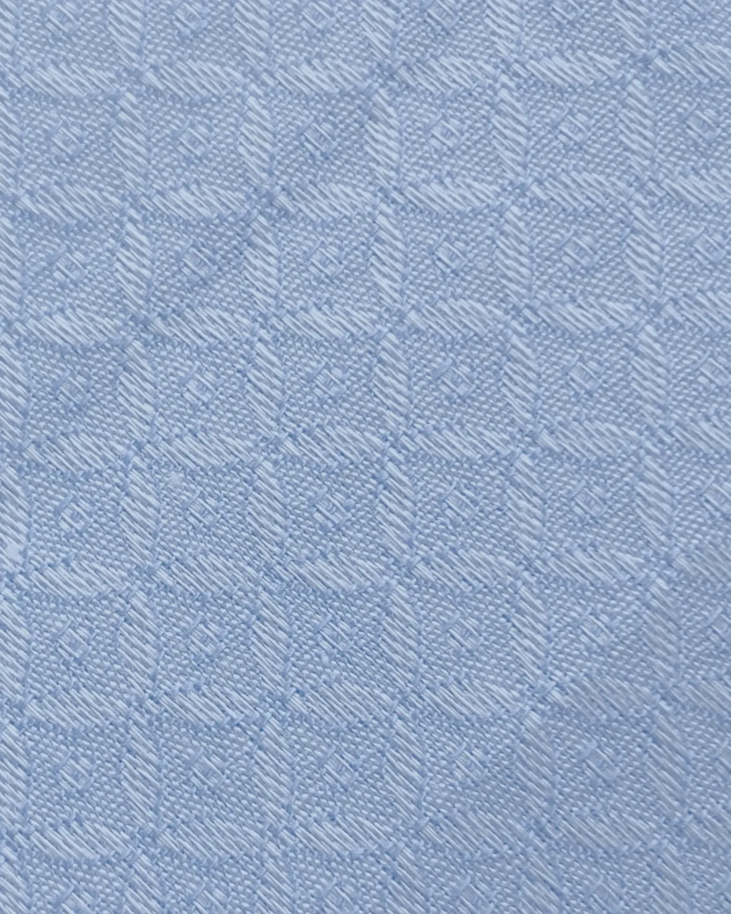 Light blue textured fabric with a small diamond pattern, suitable for clothing or upholstery.