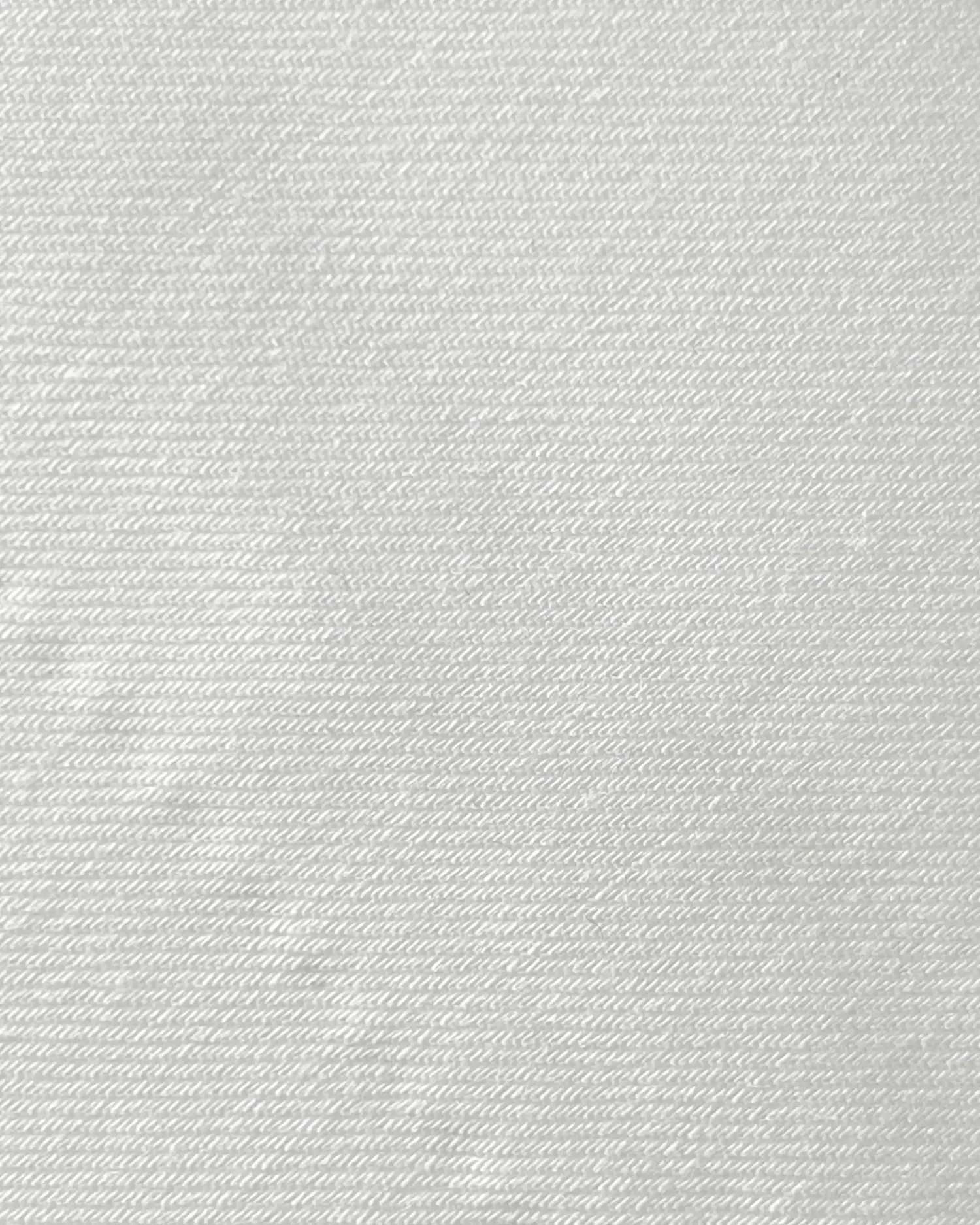 Textured white fabric close-up, highlighting diagonal woven pattern and subtle sheen. Ideal for background or design use.