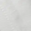 Close-up of white textured fabric showing fine horizontal stitching.