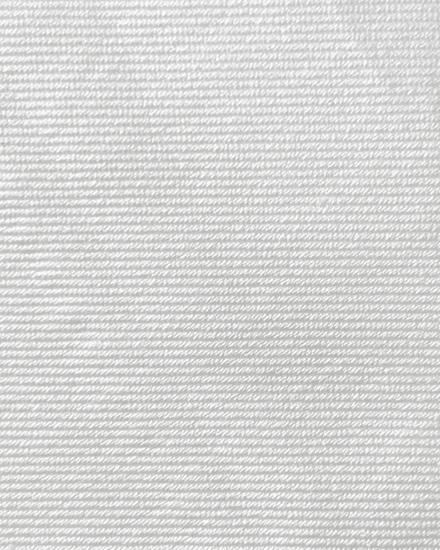 Close-up of white textured fabric with fine horizontal lines, ideal for clothing, upholstery, or design backgrounds.