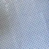 Close-up of light blue textured fabric with a woven pattern.