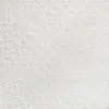Close-up of white textured fabric with a diamond pattern design, ideal for textiles and interior design.