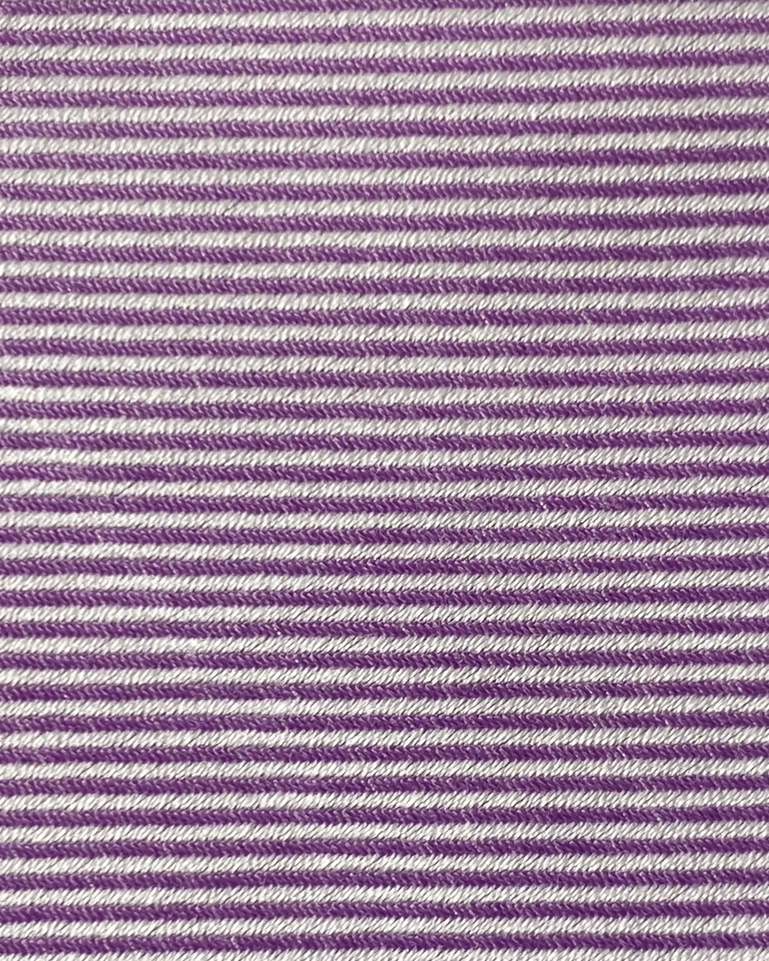 Purple and white striped fabric texture with a herringbone pattern, perfect for textile design inspiration.