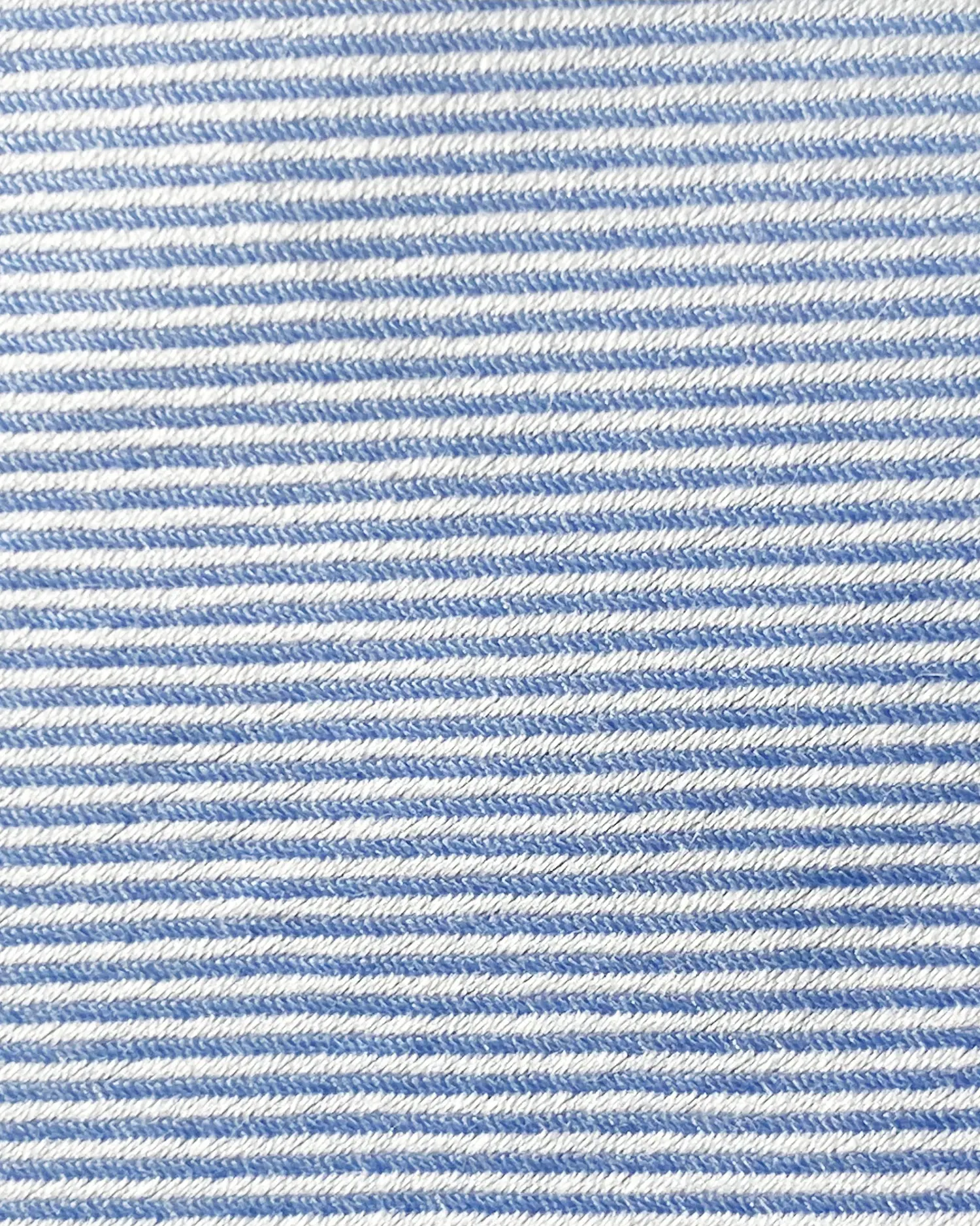 Close-up of blue and white striped fabric texture, showing detailed pattern and weave.