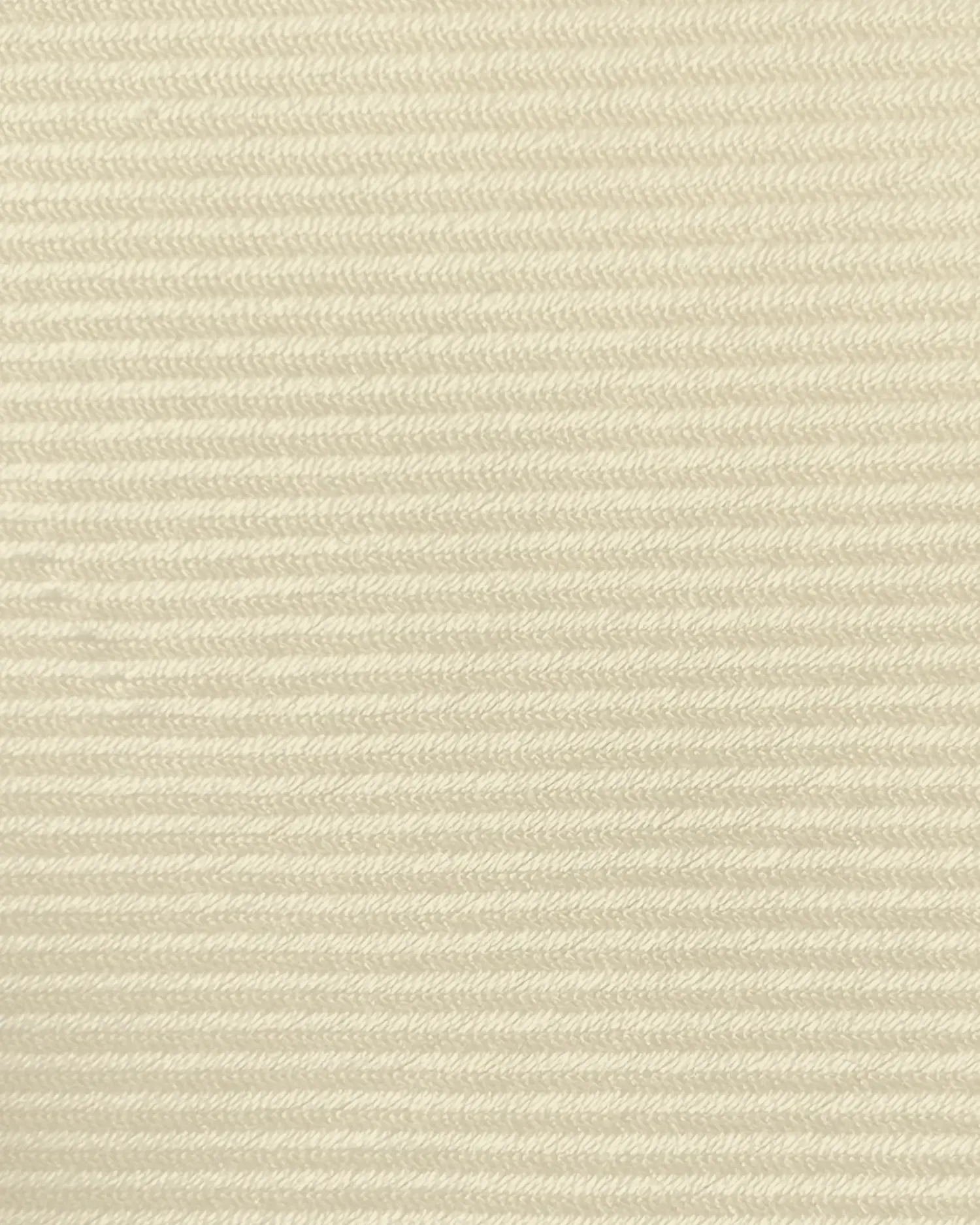 Close-up of beige textured fabric with diagonal ribbing pattern, showcasing detailed weave and natural color.