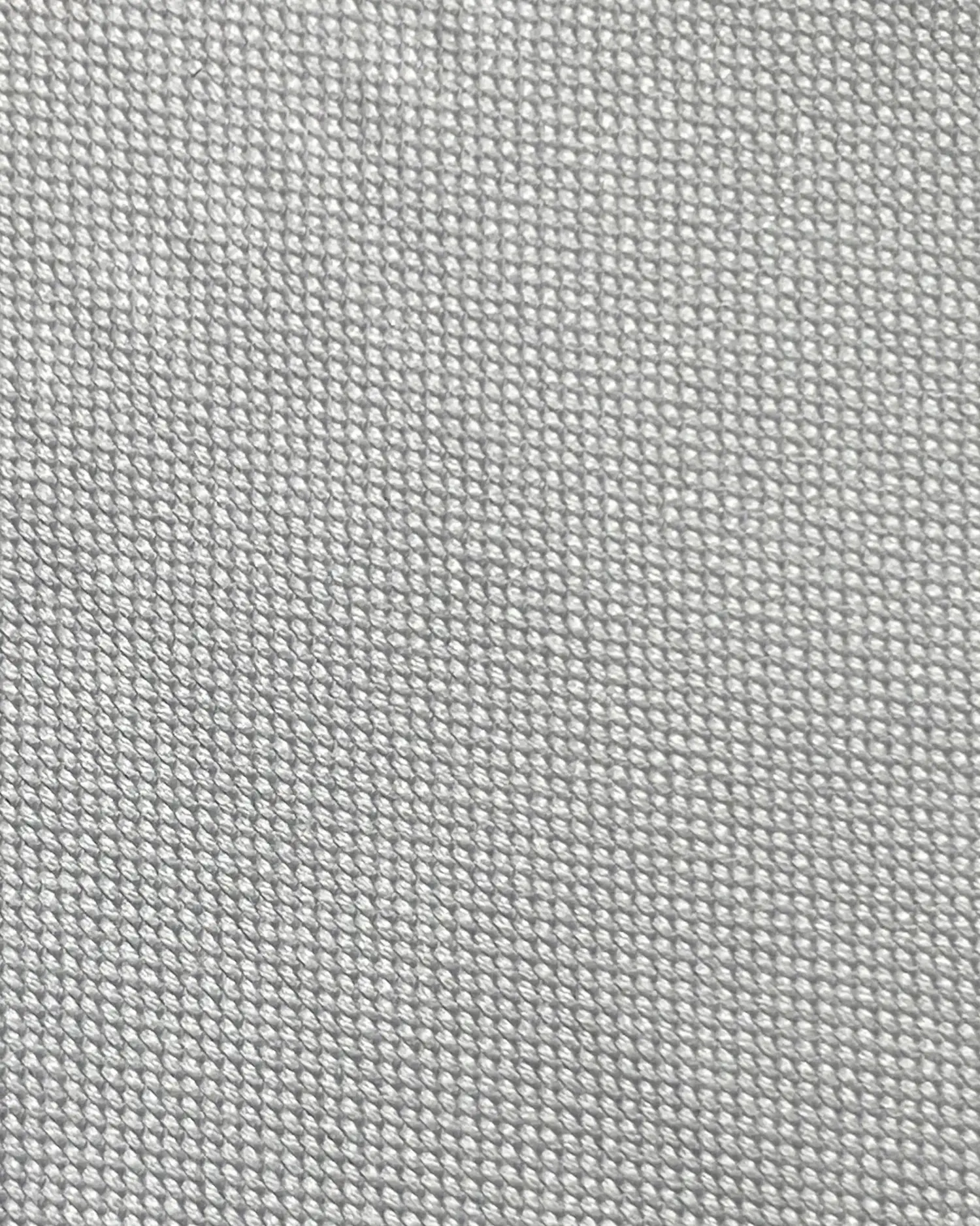 Close-up of gray burlap texture, showcasing woven fabric details. Ideal for backgrounds or design concepts.