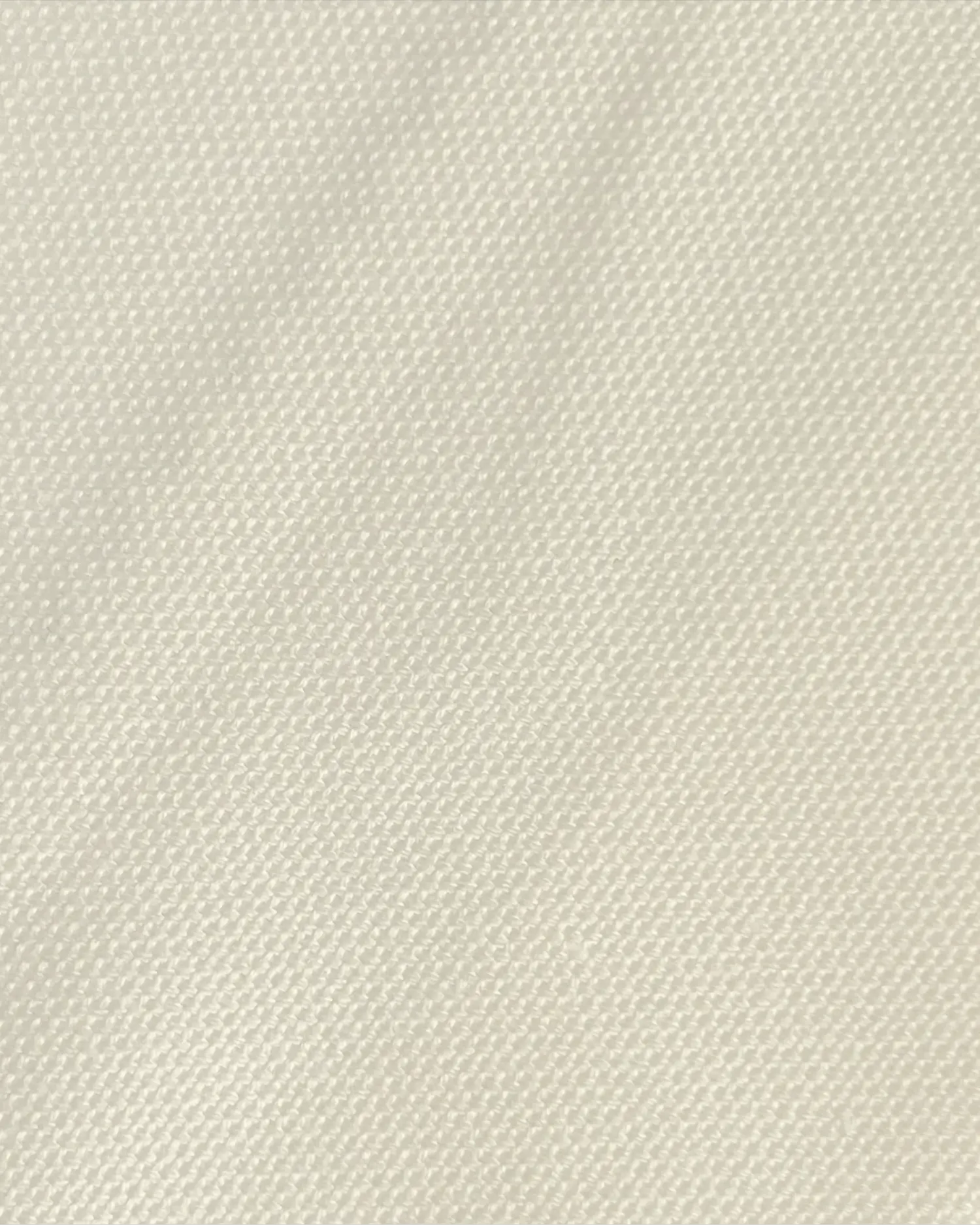 Close-up of beige textured fabric, showcasing detailed weave pattern for design and material inspiration.
