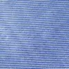 Close-up of blue and white striped denim texture, displaying woven pattern details.