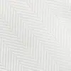 White herringbone fabric texture with diagonal woven pattern, minimalist textile design for upholstery or clothing.