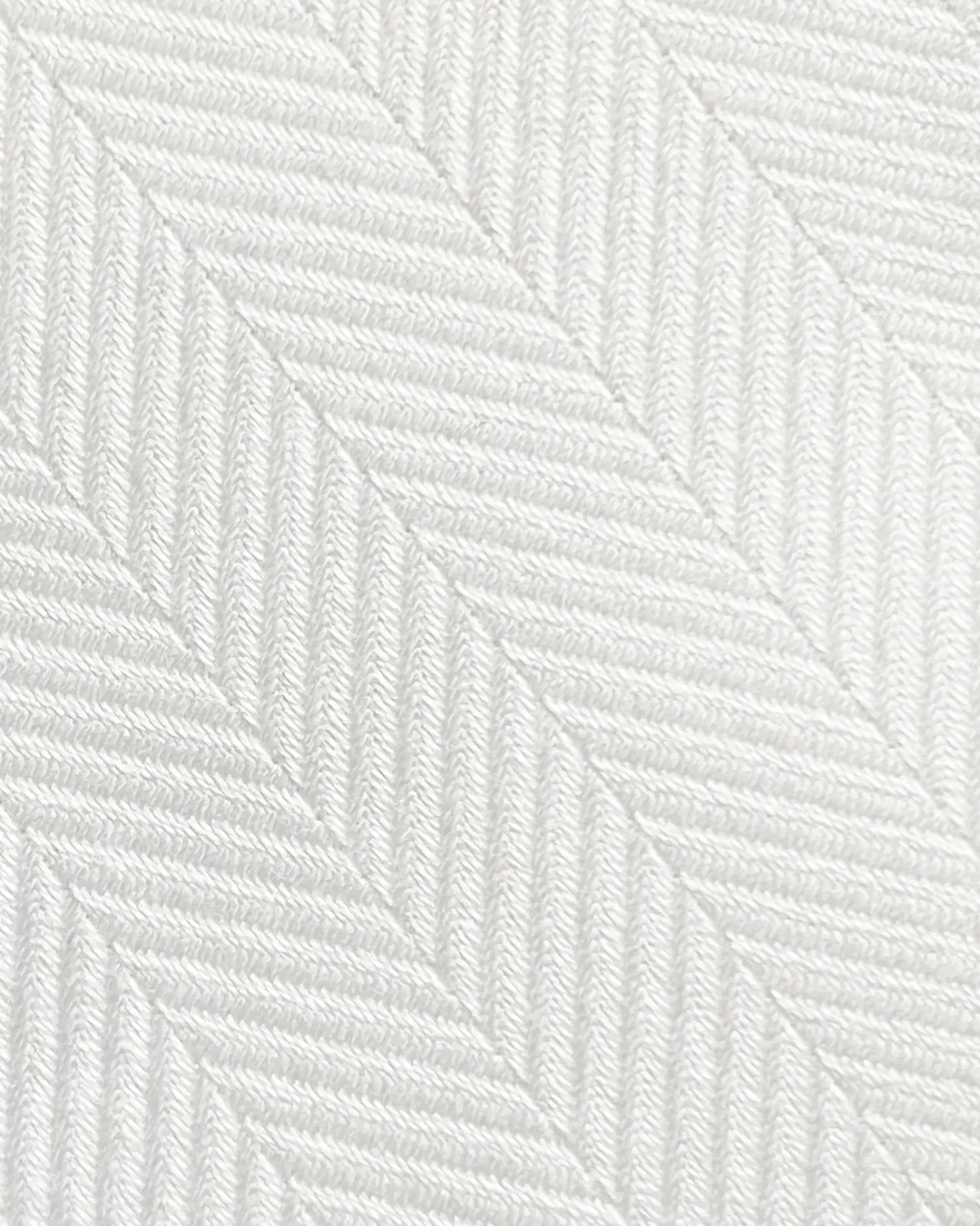 White herringbone fabric texture with diagonal woven pattern, minimalist textile design for upholstery or clothing.