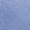 Blue and white herringbone fabric with diagonal geometric pattern, close-up view.