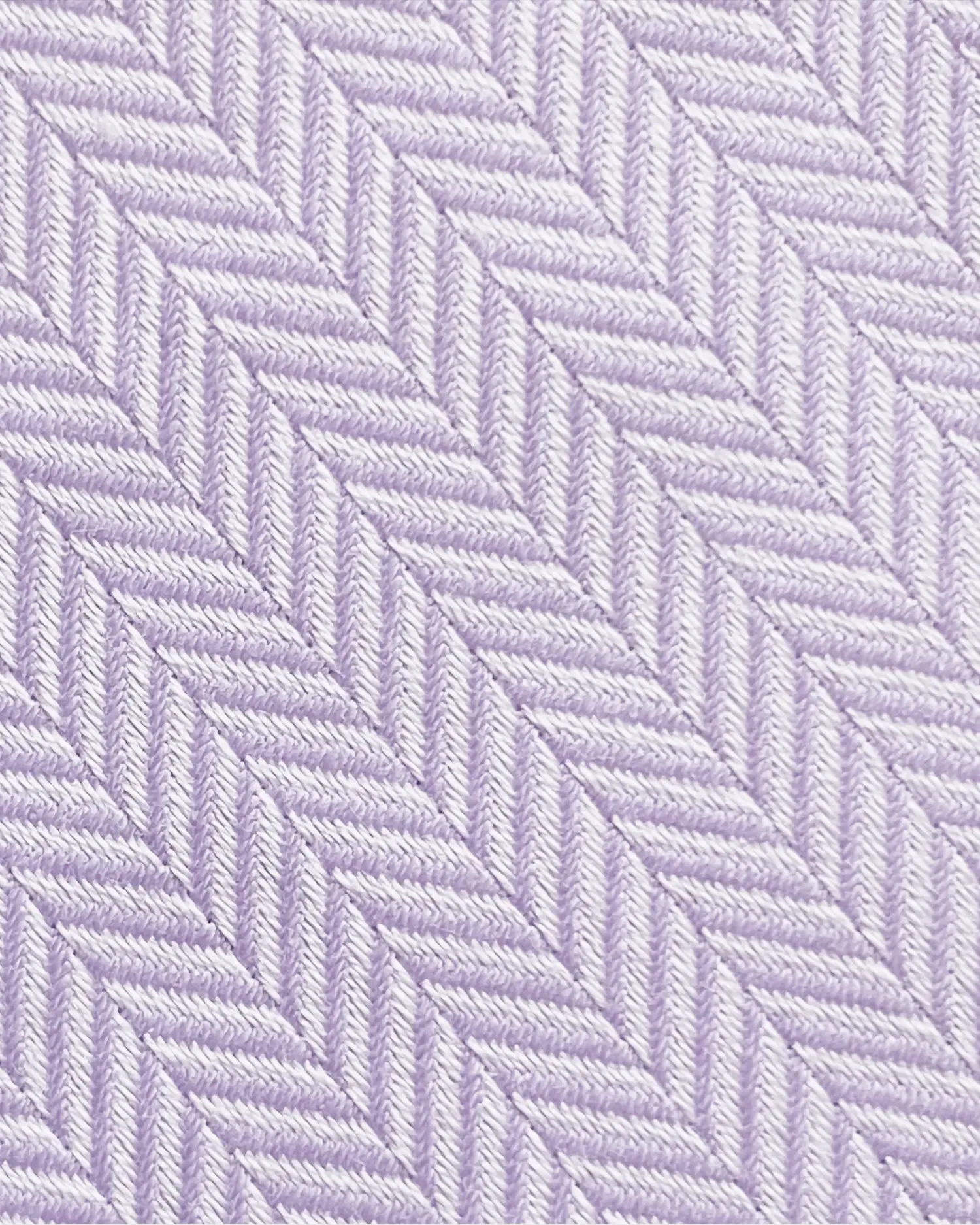 Close-up of a purple herringbone fabric texture with diagonal zigzag pattern.