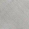 Close-up of a grey herringbone pattern fabric, showcasing detailed diagonal stitching.