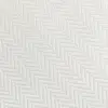 Close-up of a white herringbone fabric pattern, showcasing intricate texture and detailed diagonal weaving.
