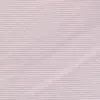 Close-up of light pink textured fabric with fine diagonal lines, showcasing soft material and subtle design.