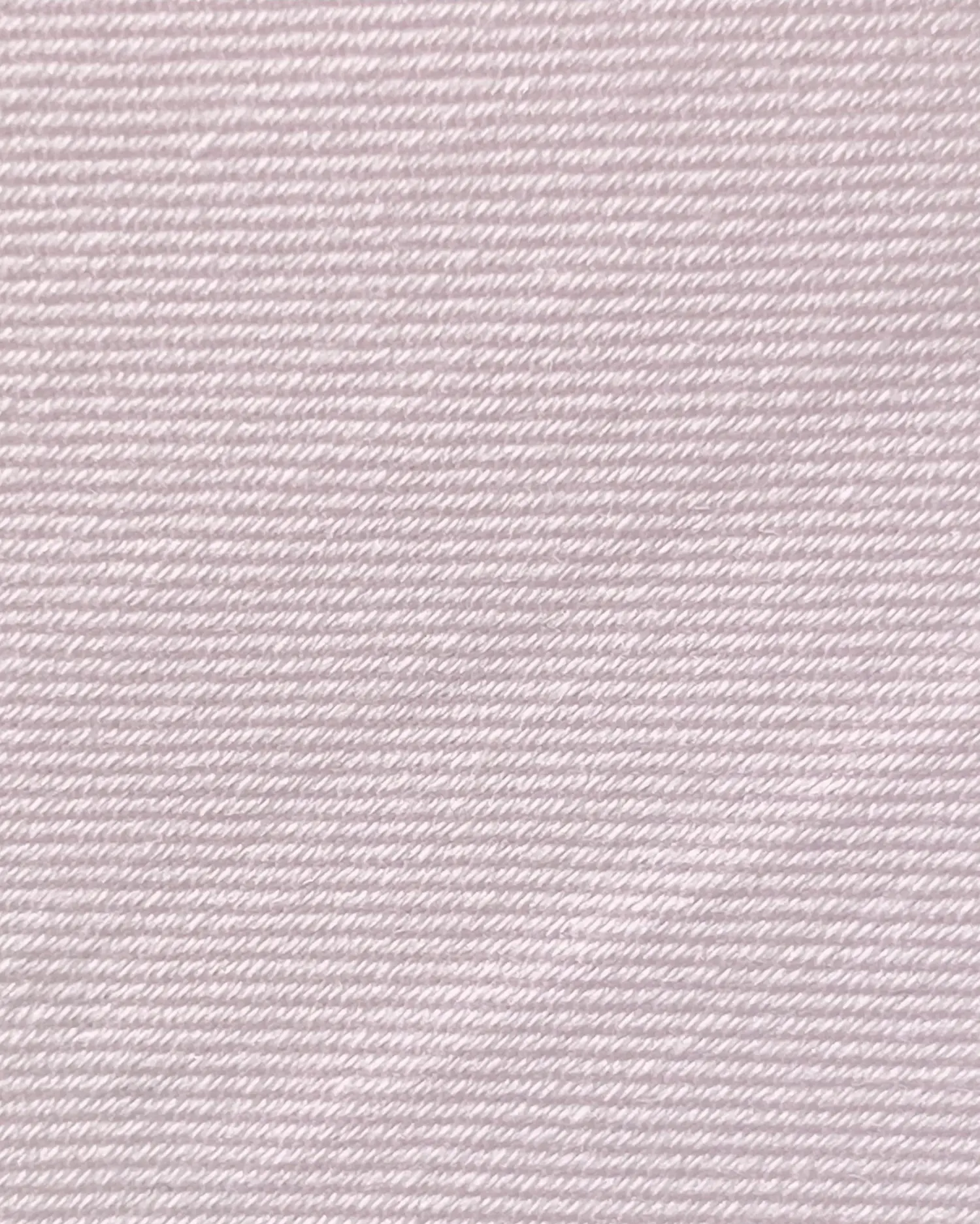 Close-up of light pink textured fabric with fine diagonal lines, showcasing soft material and subtle design.