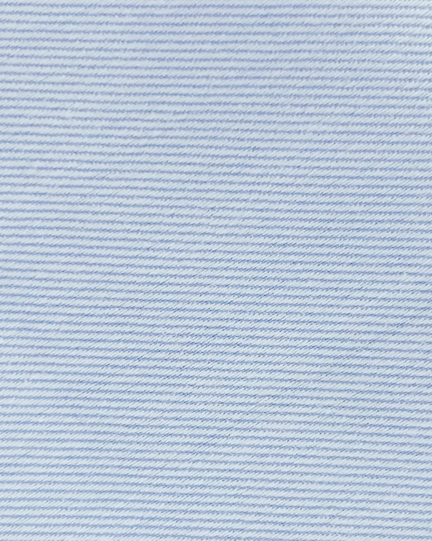 Close-up of light blue denim fabric with fine horizontal stripes, showcasing textile texture and weaving details.