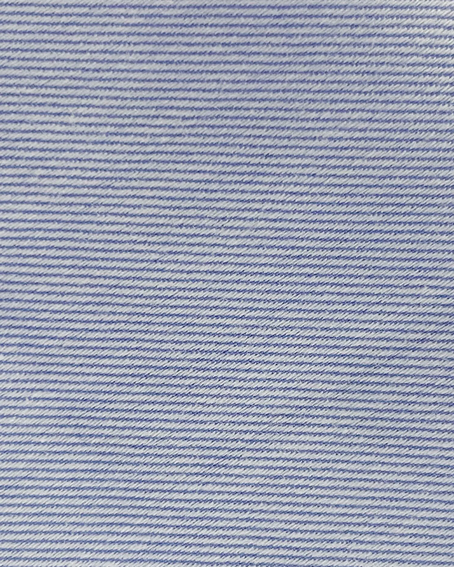 Close-up of light blue pinstripe fabric texture, showcasing diagonal stripe pattern for design and fashion purposes.