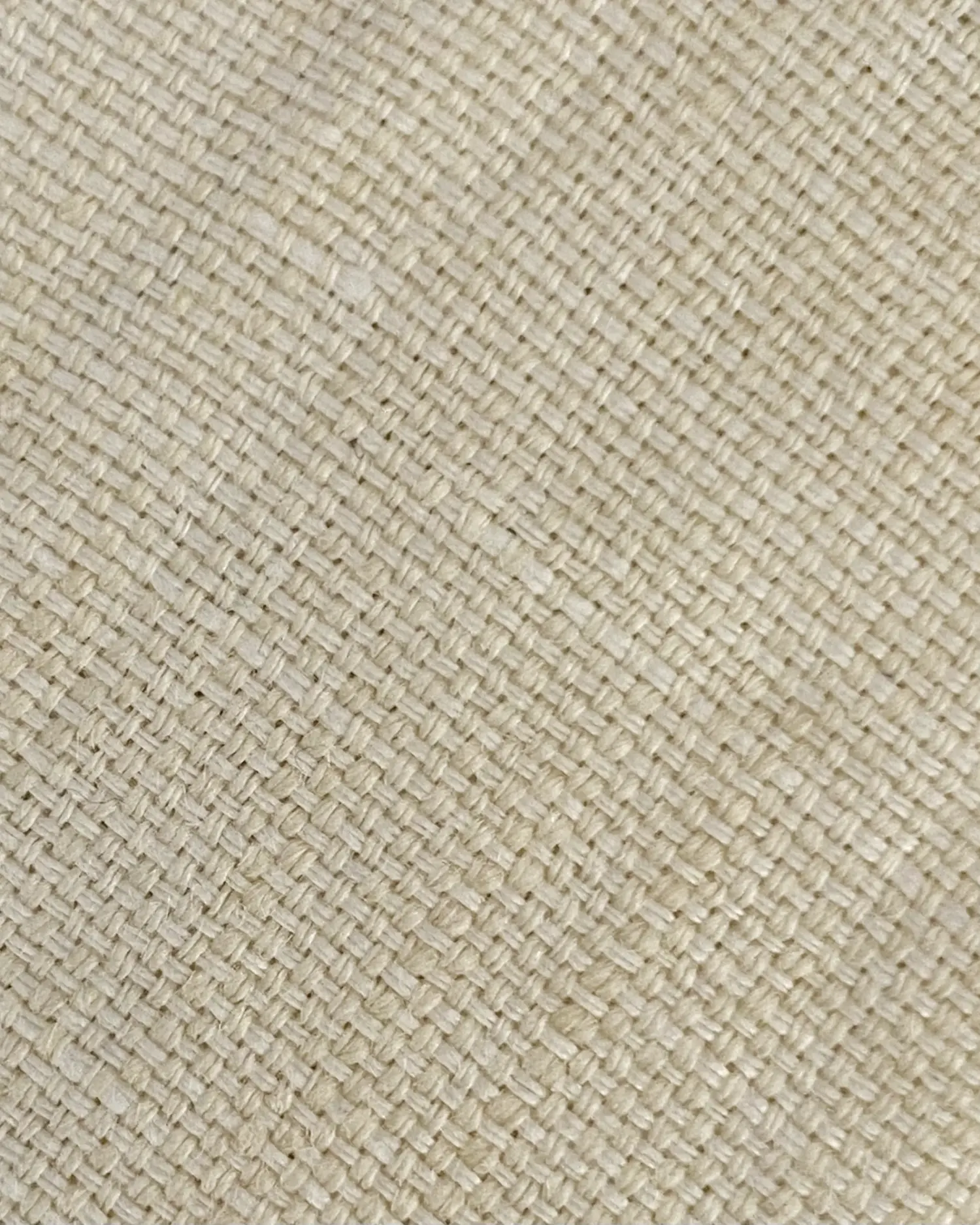 Close-up of beige woven fabric texture, showcasing intricate fiber patterns.
