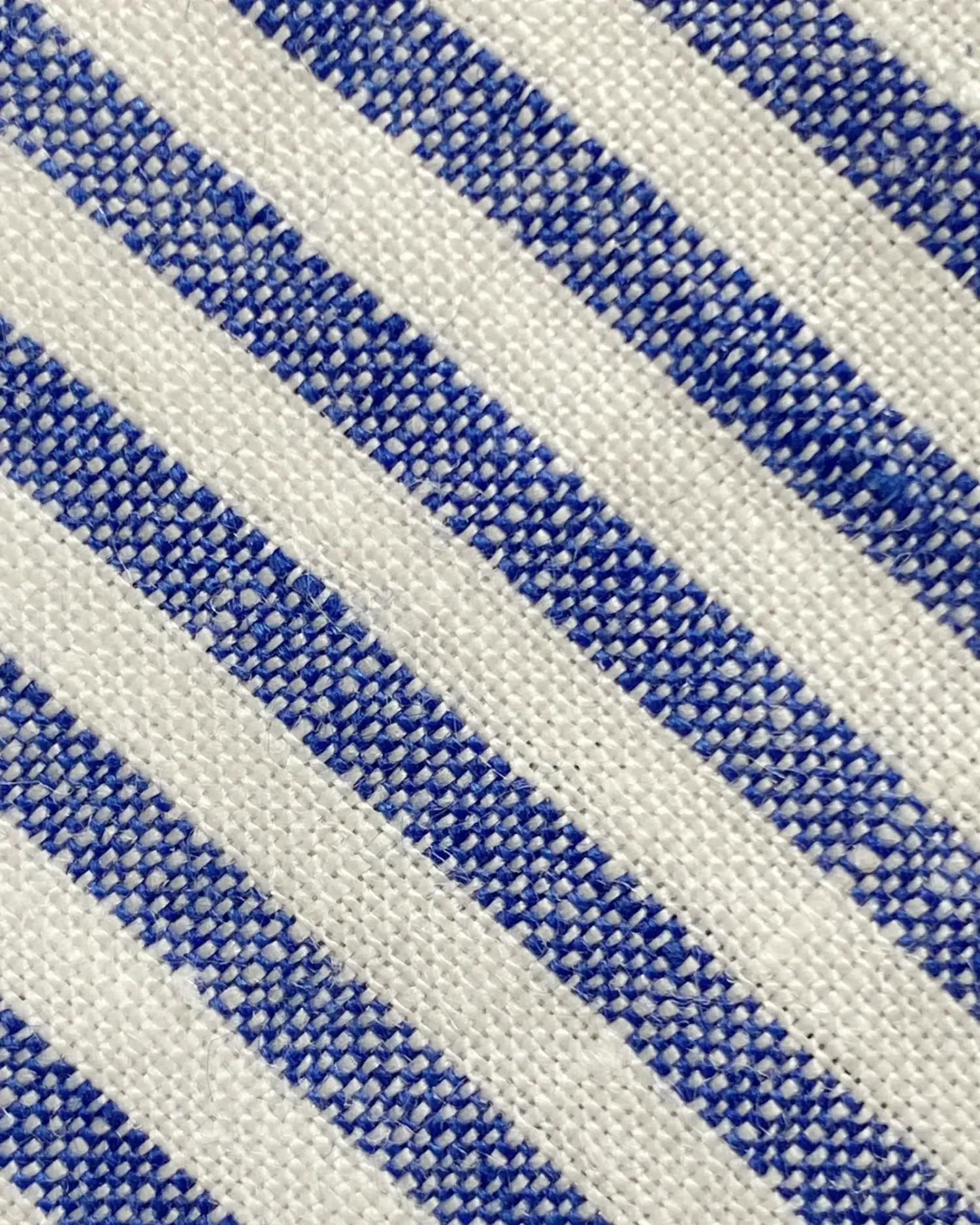 Close-up of blue and white striped fabric texture.