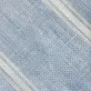 Close-up of textured blue and white woven fabric with diagonal patterns.