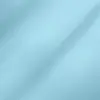 Light blue fabric texture with soft lighting, showcasing smooth, woven material. Ideal for clothing or interior design.