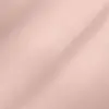 Close-up view of smooth blush pink fabric, showcasing its fine texture and soft drape.