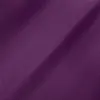 Close-up of textured purple fabric forming soft waves, showcasing rich color and smooth texture. Ideal for fashion design.