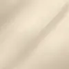 Close-up of smooth beige fabric texture with subtle shadows, emphasizing soft and elegant material appearance.