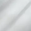 Close-up of a smooth, white fabric texture with gentle folds and a subtle sheen.