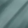 Close-up of smooth, teal fabric texture with subtle lighting and fine detailing.