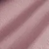 Close-up of soft pink suede fabric texture with subtle shadowing.