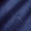 Close-up of soft, textured dark blue fabric with subtle shadows, conveying luxury and comfort.