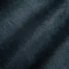 Close-up of dark textured suede fabric with subtle shading, showcasing soft surface details. Ideal for fashion or upholstery.