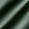 Close-up of green textured fabric with diagonal shadows creating a striped pattern.