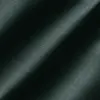 Close-up of dark green textured fabric with diagonal folds, showcasing its smooth surface and gentle sheen.