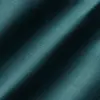 Close-up of textured dark teal fabric with diagonal shadows.