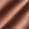 Close-up of textured brown fabric with subtle diagonal lighting.