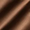 Close-up of brown textured fabric with diagonal shadow lines, creating a soft and elegant appearance.