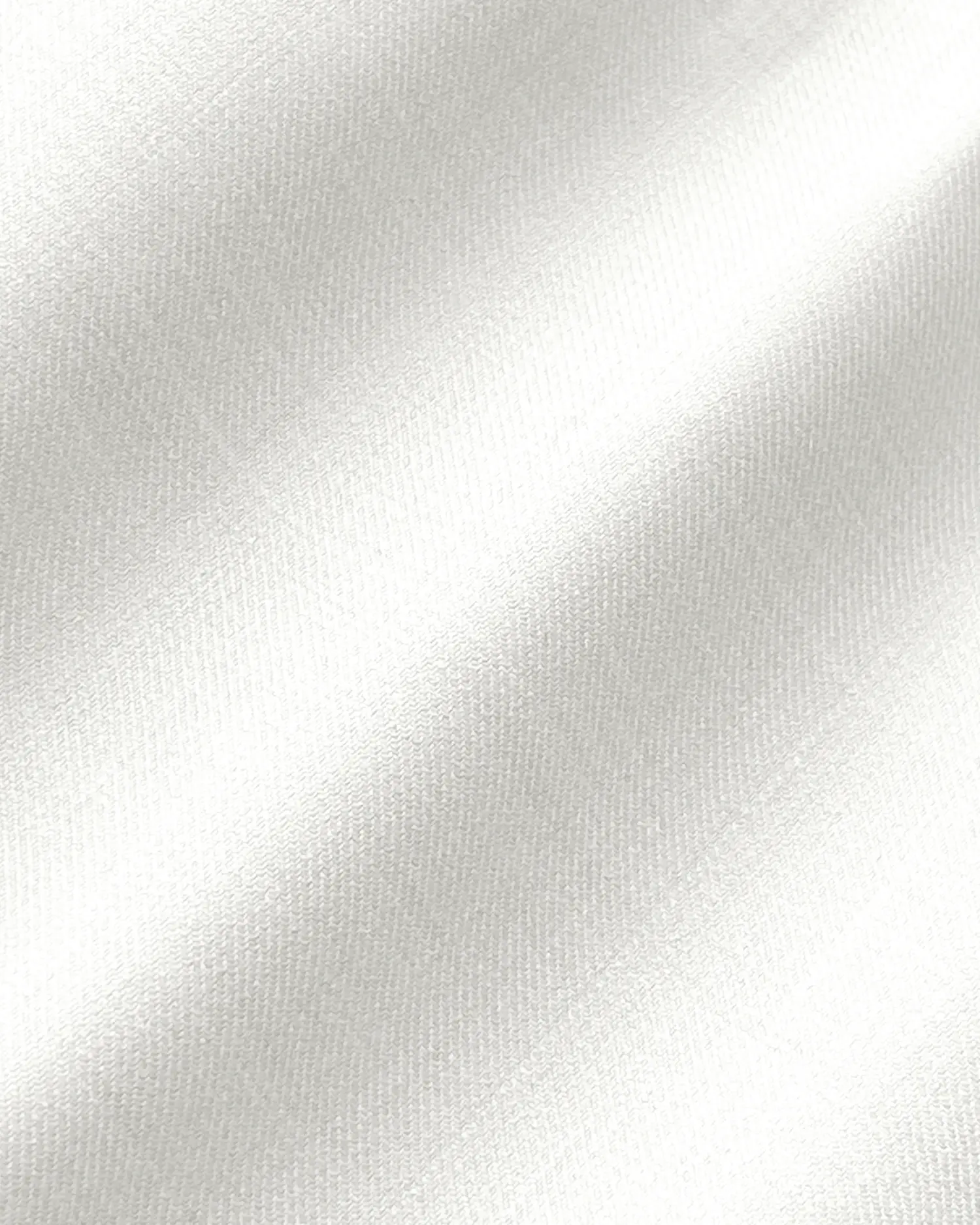 Smooth white satin fabric close-up, showcasing a luxurious and elegant texture.
