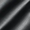 Black woven fabric with diagonal light and shadow pattern, showing textured detail.