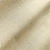 Close-up of beige fabric with a detailed herringbone pattern, showcasing texture and weave.