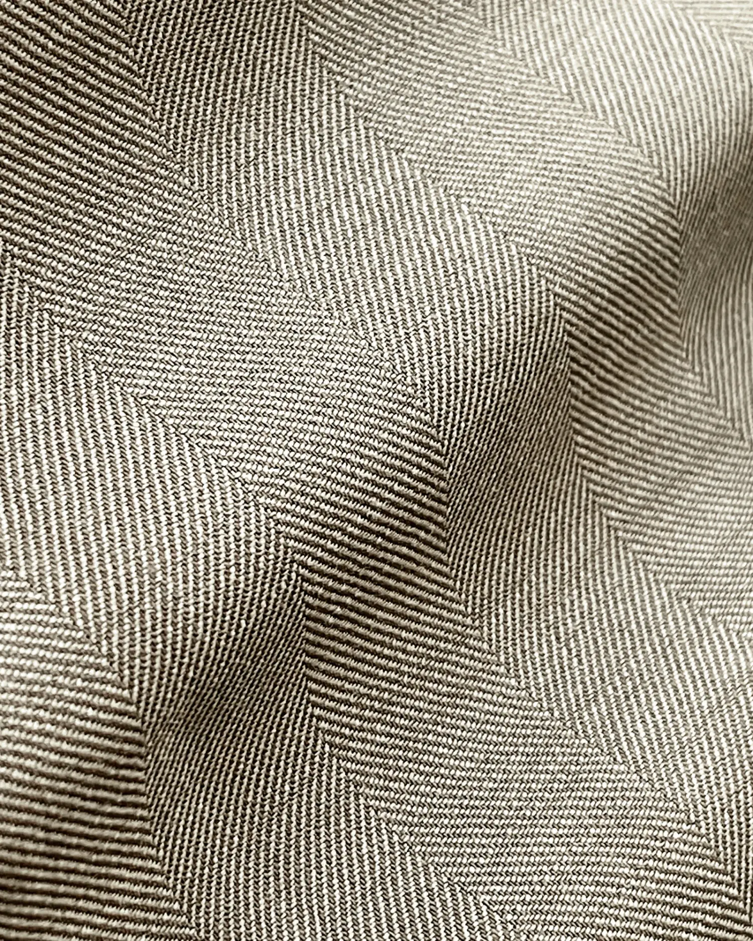 Close-up of textured beige fabric with intricate, wavy patterns creating a soft, rippled effect.