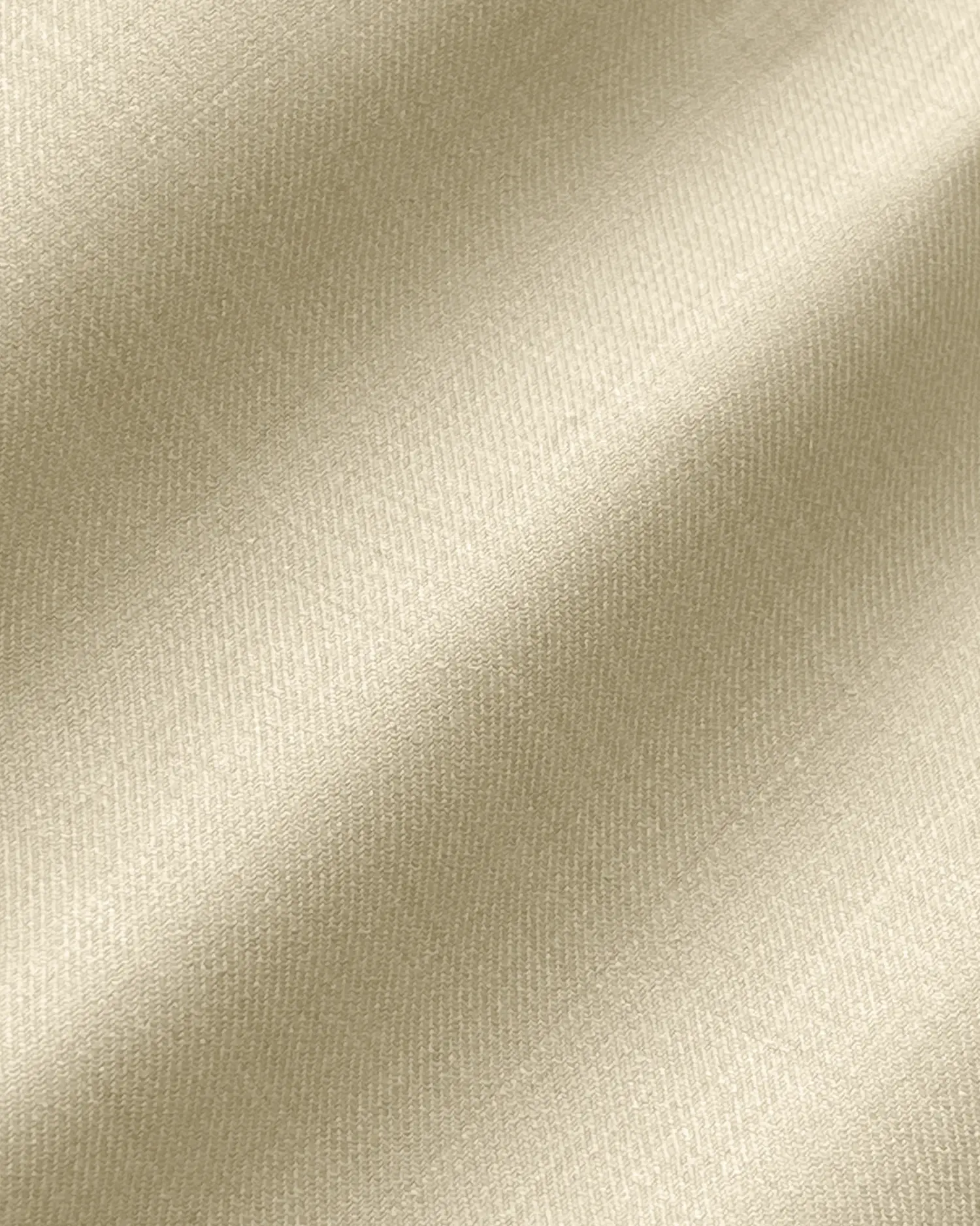 Close-up of smooth beige silk fabric texture, showing luxurious sheen and softness. Ideal for fashion and textile concepts.